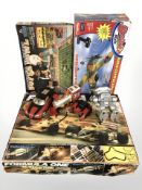 A Scalextric Formula One racing set, an NFL Superbowl game, a further remote control car, toy robot,