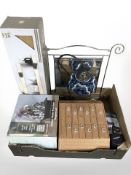 A modern multi drawer chest, water fountain, set of floating shelves, mirror,