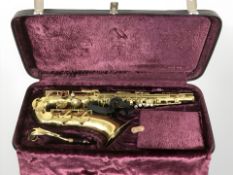 A Corton by Amati brass saxophone, in case.