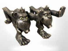 A pair of painted cast iron mythical beast figures, height 14 cm.