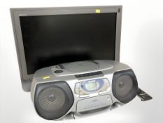 A Sony Bravia TV, with remote, and a Philips radio.