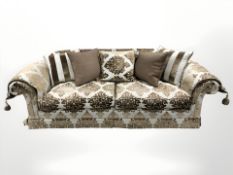 A contemporary four piece lounge suite comprising three seater settee, length 275 cm,