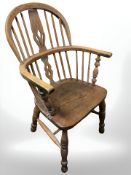An early 20th century elm spindle back Windsor chair,