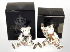 Two Royal Crown Derby seated teddy bear paperweights, lacking stoppers, both boxed.