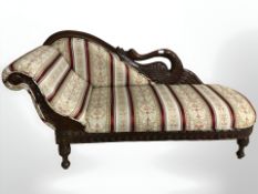 A reproduction miniature mahogany chaise longue, with swan back rest, length 93 cm.