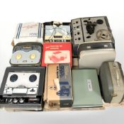 A group of vintage reel to reel players, projector, etc.