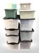 A group of plastic storage boxes with lids, largest 57 cm long.