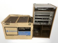 A record cabinet containing a Binatone hi-fi system including amplifier, stereo tuner,