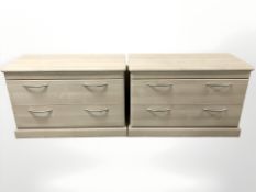 A pair of contemporary laminated two drawer chests, 91 cm W x 46 cm D x 61 cm H.