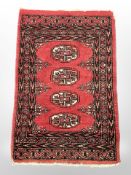 A small Turkoman rug, Afghanistan, 71 cm x 48 cm.