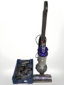 A Dyson DC50 upright vacuum cleaner, with attachments.