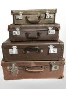 Four various vintage luggage cases, largest 65 cm wide.