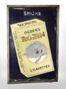An Ogden's Robin Cigarettes enamelled sign in later wooden frame,