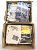 A group of vintage motoring magazines and publications.
