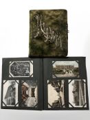 Two albums of antiquarian monochrome and colour postcards, portrait photographs, etc.