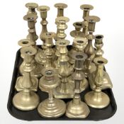 A collection of Victorian brass candlesticks.