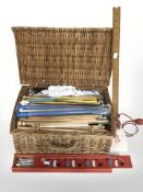 A wicker basket of knitting needles