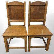 A pair of oak ecclesiastical chairs