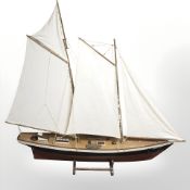 A large model pond yacht on stand, length 144 cm.