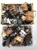 A large quantity of vintage cameras.