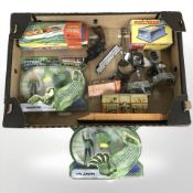A group of toys and models including Green Lantern, electric speedboat, die cast pistol,