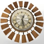 A Bentima teak quartz sunburst timepiece, diameter 36 cm.