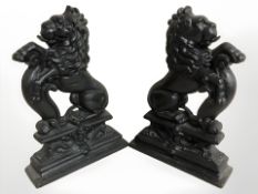 A pair of reproduction painted cast iron lion doorstops, height 36 cm.