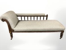 An Edwardian oak chaise longue,