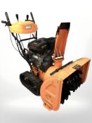 A Rock Machinery Model 10 11HP snow thrower, with Loncin 337cc gasoline engine.