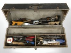 An antique joiner's toolbox containing assorted carpentry tools.