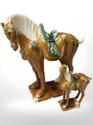 Two Tang style pottery horses, tallest 26 cm.