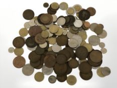 A small tin of British and world coins.