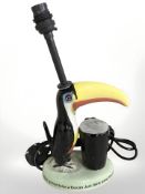 A reproduction Guinness toucan table lamp, height 33 cm including fitting.