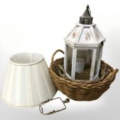 Two wicker baskets, light shade, a modern terrarium.