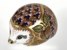 A Royal Crown Derby Orchard Hedgehog paperweight with gold stopper.