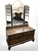 An early 20th century oak three drawer mirror back dressing chest, 108 cm W x 47 cm D x 160 cm H.