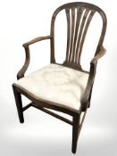 A carved mahogany carver chair and a salon chair