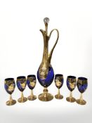 A gilt blue glass tall ewer with hand painted decoration, height 48 cm,