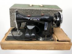 An Arrow electric sewing machine with lead and pedal.