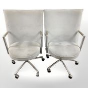 A pair of Danish Erik Jorgensen designed 'Partner' chrome-framed executive swivel armchairs,