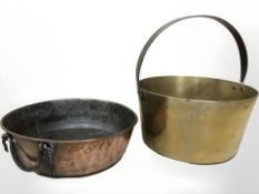 A brass jam pan and a copper twin handled cooking pot.