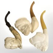Three Meerschaum pipes with figural bowls, two in the form of Turks wearing turbans.