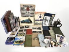 A vintage hand held torch, volumes and DVD's relating to trains,