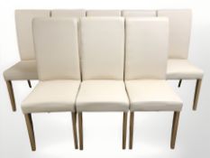 A contemporary set of eight stitched cream leather high backed dining chairs.