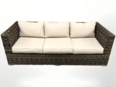 A woven plastic garden/conservatory two seater settee, width 193 cm,