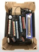 A group of OO gauge die cast rolling stock including Lima, Triang, lengths of track, control unit,