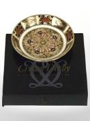 A Royal Crown Derby Old Imari shallow circular dish, diameter 11 cm, boxed.