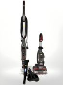 A Shark floor cleaner, a vacuum cleaner and a further stick vacuum.