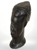 An African carved hardwood bust, height 18 cm.