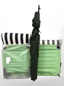 Two garden reclining chairs with cushions and a parasol